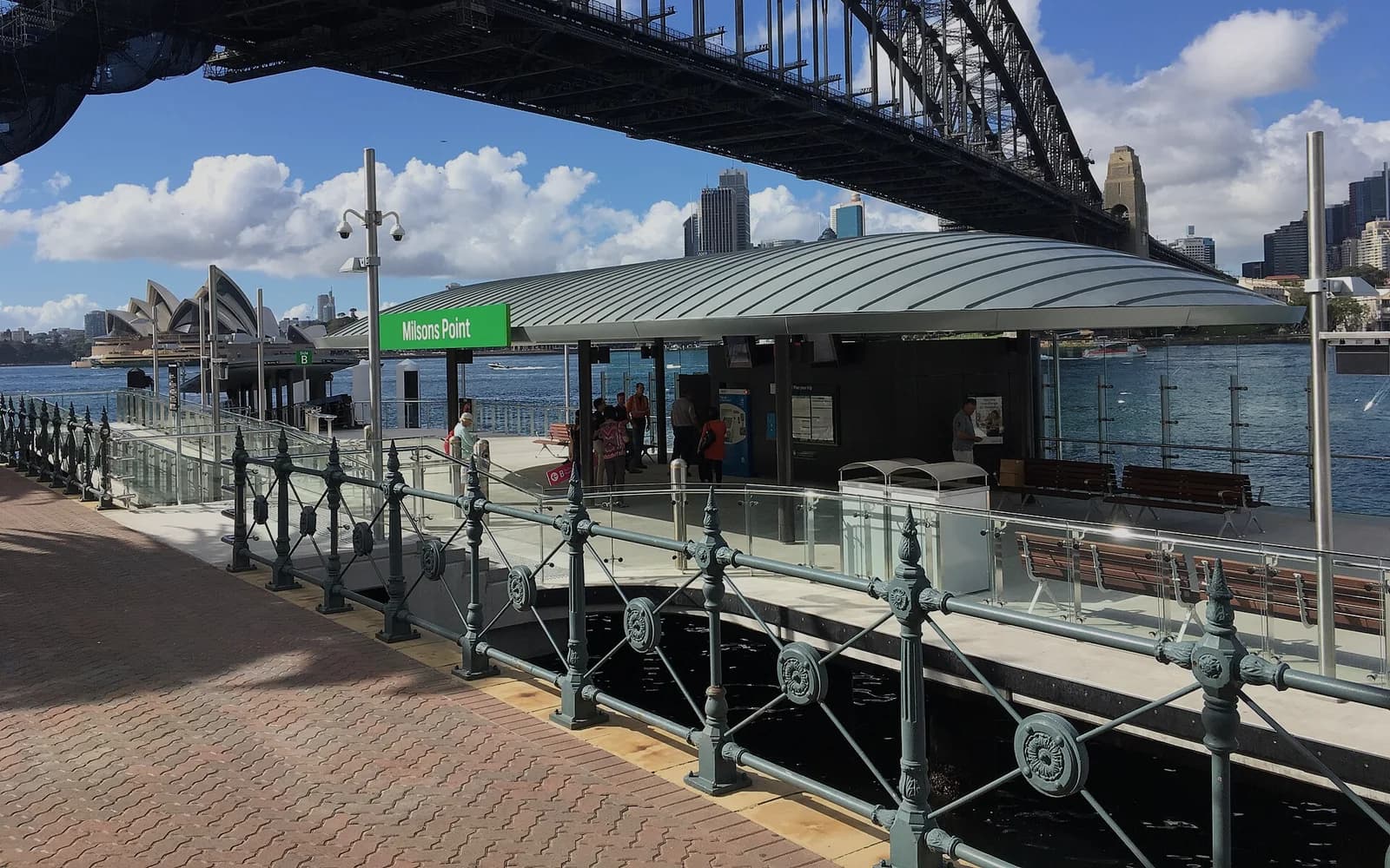 The Sydney Harbour Bridge and Opera House seen from the promenade at Milsons Point
