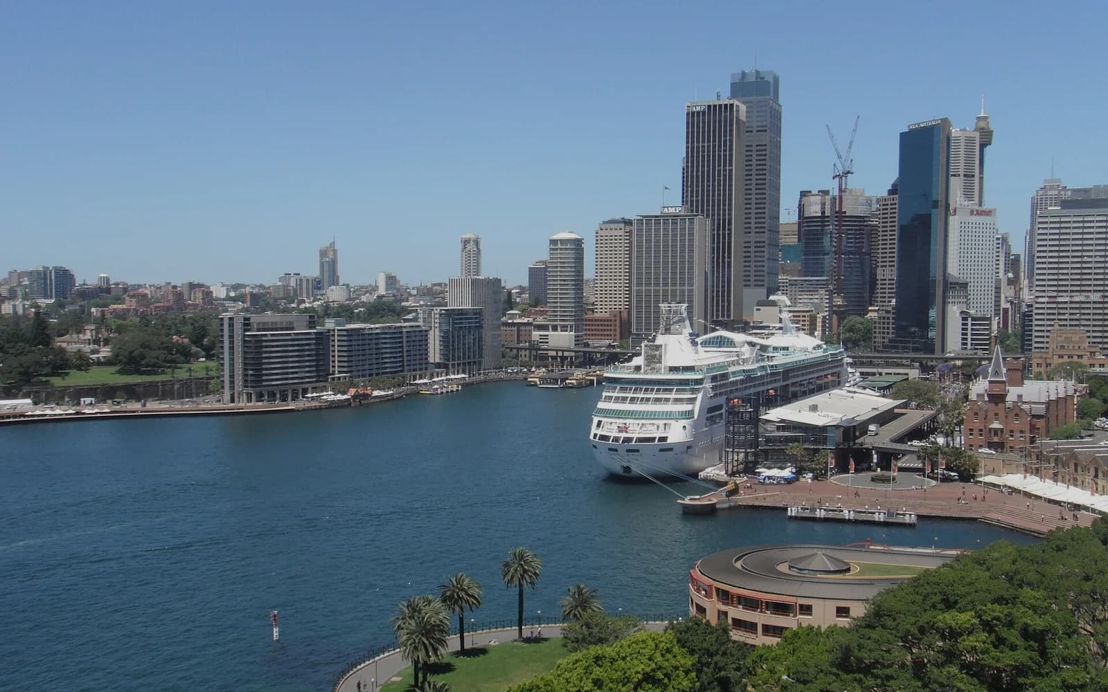 A cruise ship berthed on Sydney Harbour, served by cruise terminal transfers